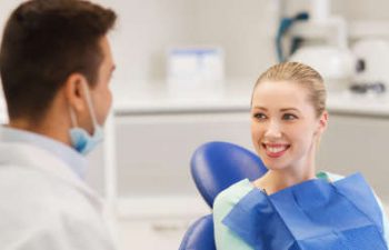 patient smiling to the dentist